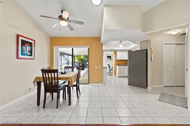 tiled dining room featuring ceiling fan