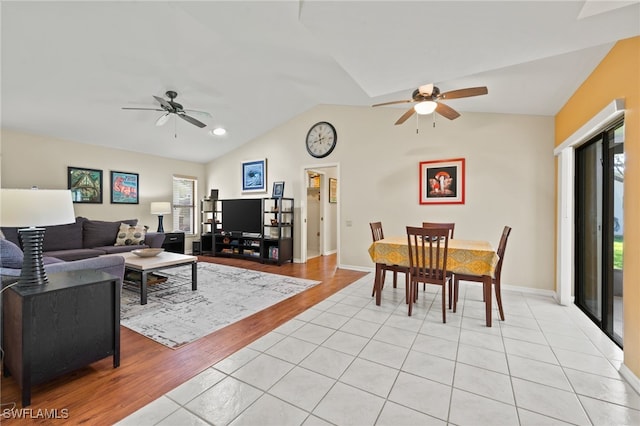 tiled living room featuring vaulted ceiling and ceiling fan