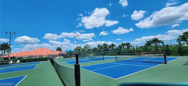 view of sport court with basketball hoop