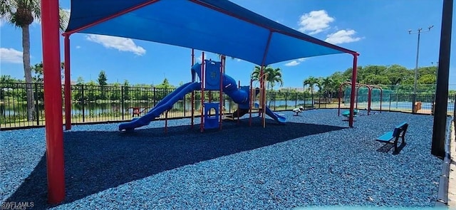 view of jungle gym with a water view