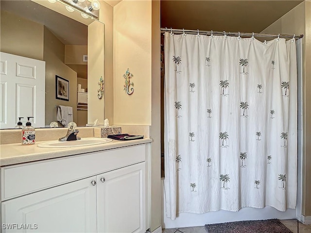 bathroom featuring shower / bath combo with shower curtain and vanity