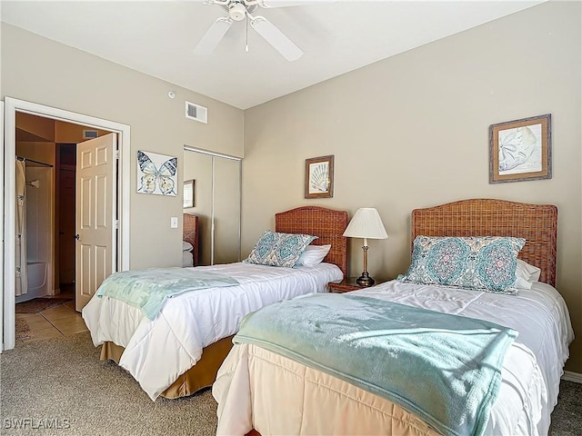 bedroom featuring carpet, ceiling fan, and a closet