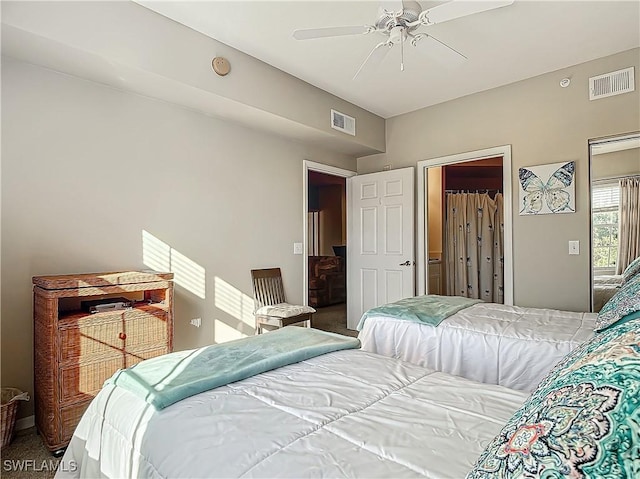 carpeted bedroom with ceiling fan