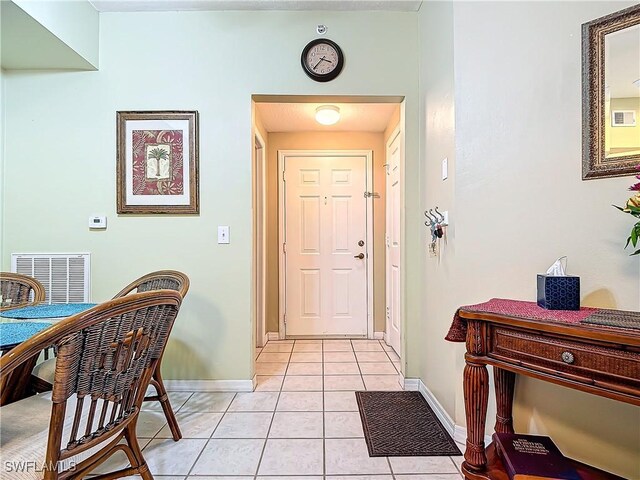 foyer with light tile patterned floors