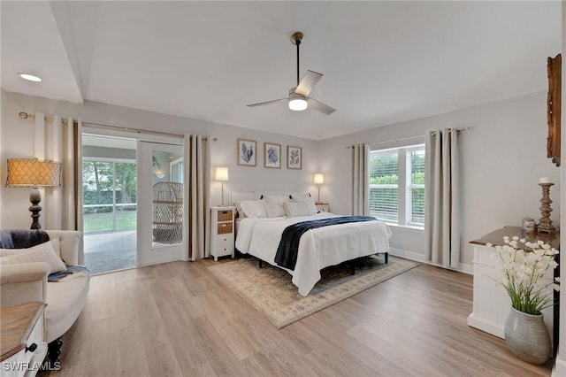 bedroom with ceiling fan, access to outside, and light hardwood / wood-style flooring