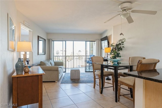 living room featuring ceiling fan and light tile patterned floors