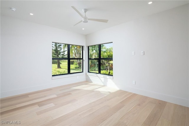 unfurnished room with light wood-type flooring and recessed lighting