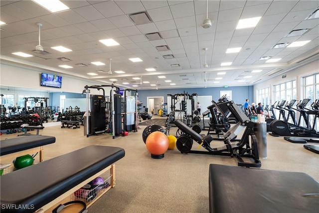 gym featuring visible vents and a drop ceiling