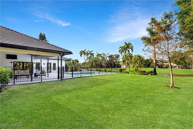 view of yard with a fenced in pool, fence, and a patio