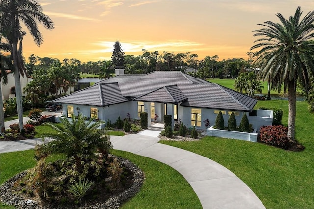 view of front of property with a yard