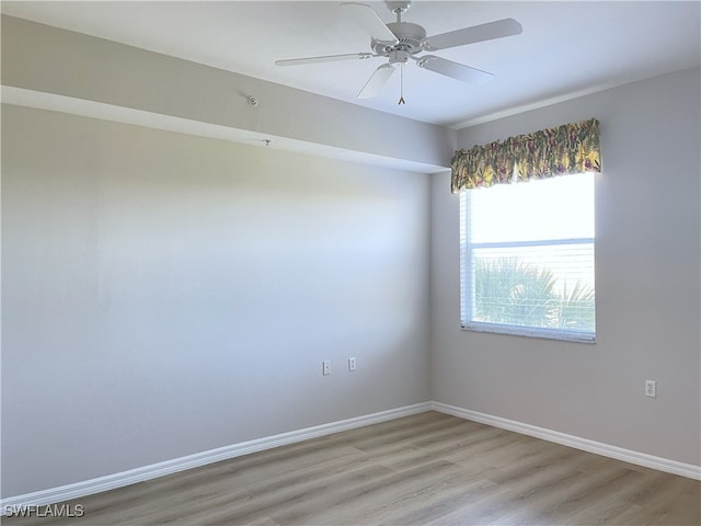 spare room featuring ceiling fan and light hardwood / wood-style flooring