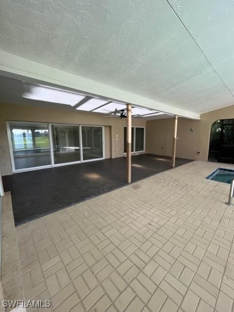 view of patio featuring a swimming pool