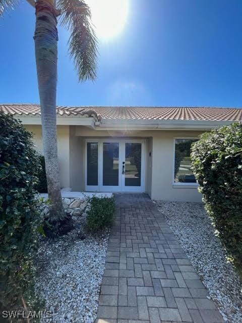 back of house featuring french doors