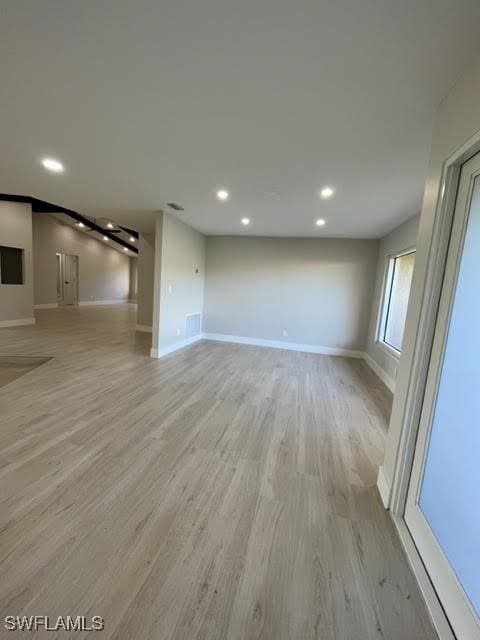 unfurnished living room with light hardwood / wood-style flooring