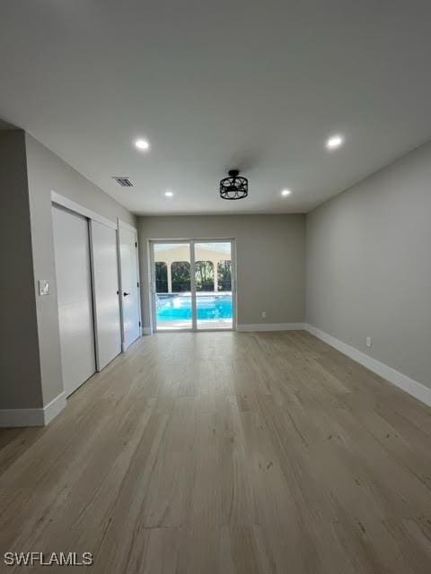 unfurnished room featuring light hardwood / wood-style flooring