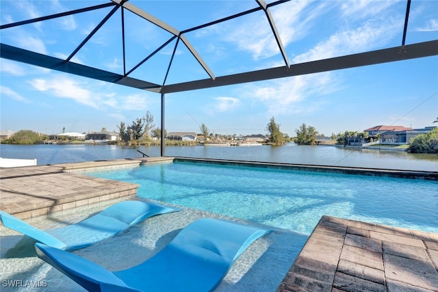 view of pool featuring glass enclosure and a water view