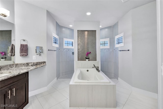 bathroom with tile patterned flooring, vanity, plenty of natural light, and shower with separate bathtub