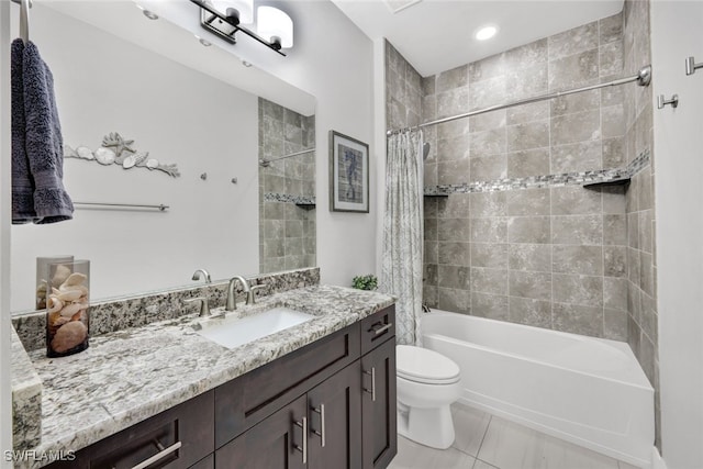 full bathroom featuring tile patterned floors, vanity, toilet, and shower / tub combo