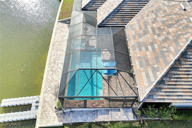 birds eye view of property featuring a water view