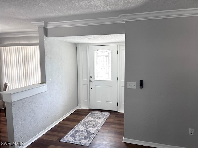 foyer featuring a textured ceiling, dark hardwood / wood-style floors, and crown molding