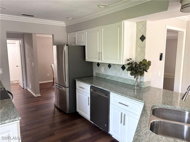 kitchen featuring light stone counters, sink, white cabinets, and stainless steel appliances