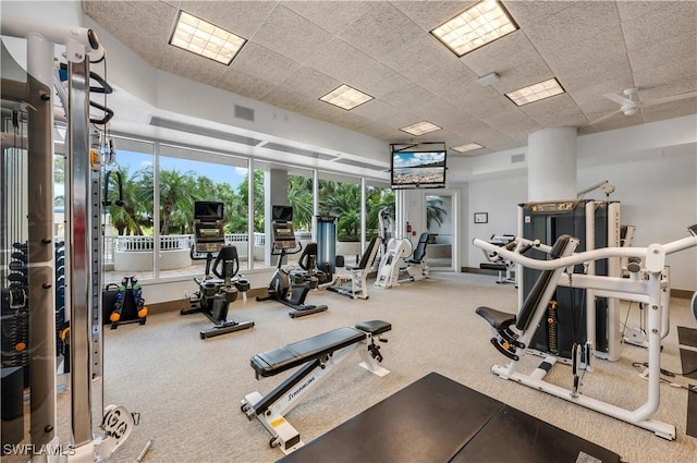 exercise room featuring a paneled ceiling