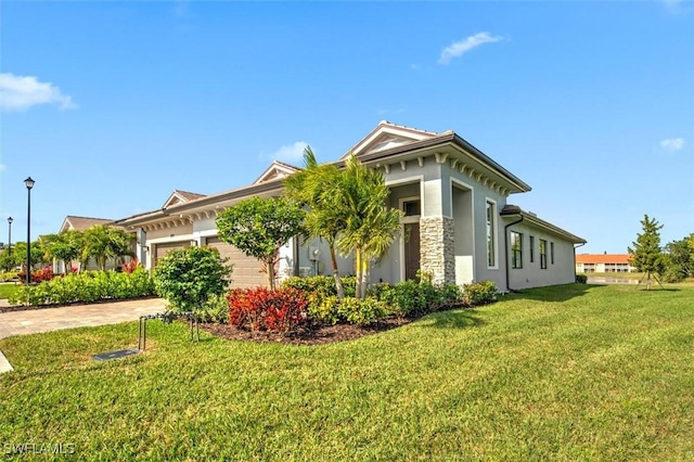 view of side of home with a garage and a lawn