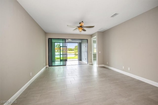 unfurnished room with ceiling fan