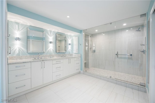 bathroom with vanity, tile patterned flooring, and a shower with door