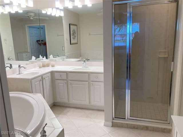 bathroom with tile patterned floors, vanity, ceiling fan, and plus walk in shower