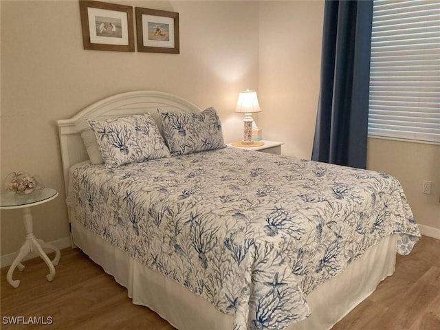 bedroom featuring wood-type flooring