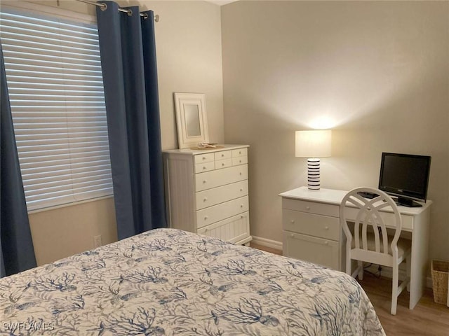 bedroom featuring hardwood / wood-style flooring