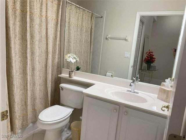 bathroom featuring tile patterned flooring, vanity, and toilet