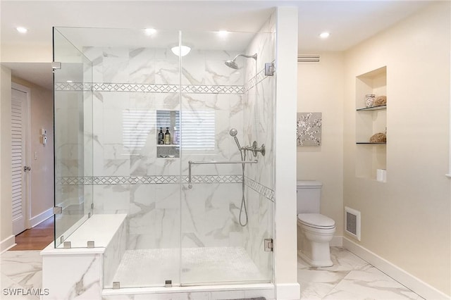 bathroom with visible vents, toilet, marble finish floor, a stall shower, and baseboards