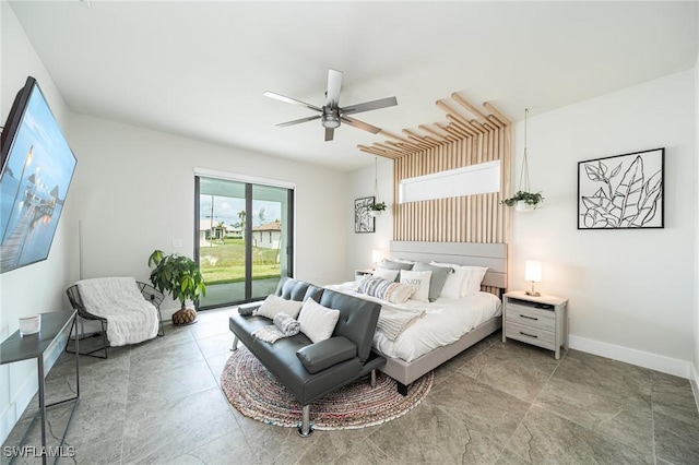 bedroom featuring ceiling fan and access to outside