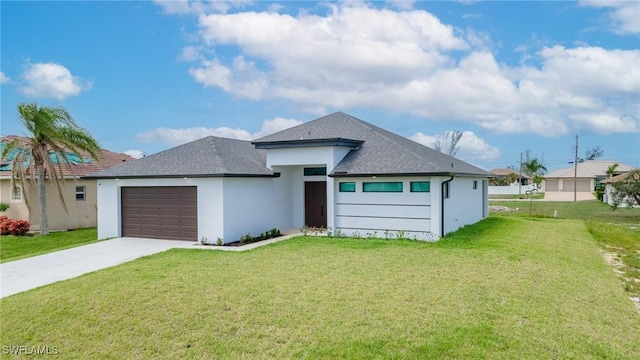 view of front facade with a front yard and a garage