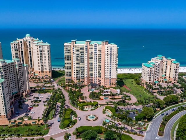 bird's eye view featuring a beach view and a water view