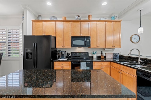 kitchen featuring sink, hanging light fixtures, crown molding, dark stone counters, and black appliances