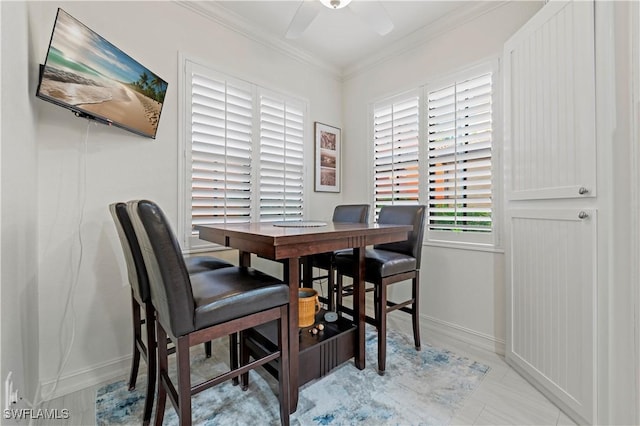 dining room featuring crown molding and ceiling fan