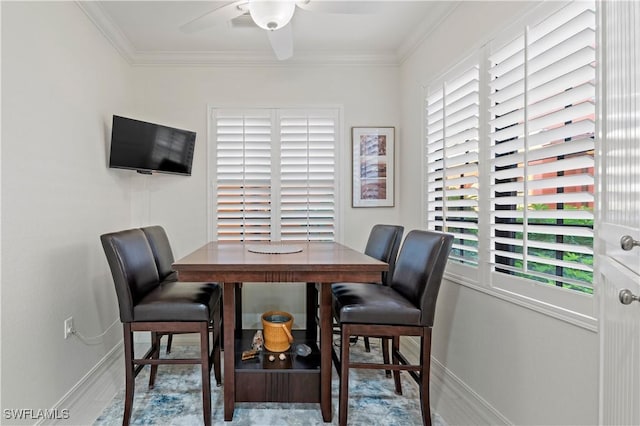 dining room with hardwood / wood-style floors and ornamental molding