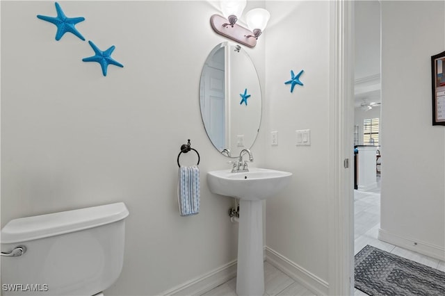 bathroom with tile patterned flooring, toilet, and sink