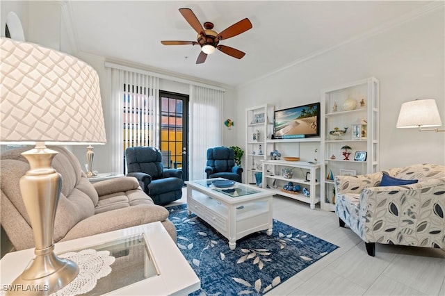 living room featuring ceiling fan and crown molding