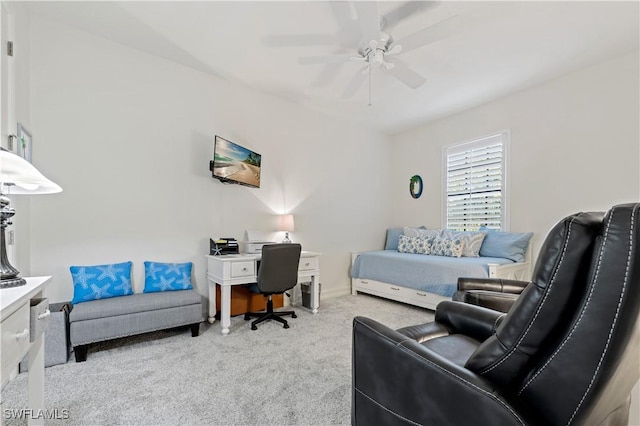 office space featuring ceiling fan and light colored carpet