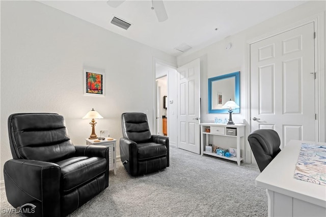 office featuring ceiling fan and light colored carpet