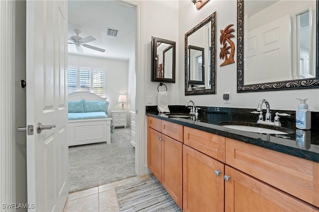 bathroom featuring tile patterned floors, vanity, and ceiling fan