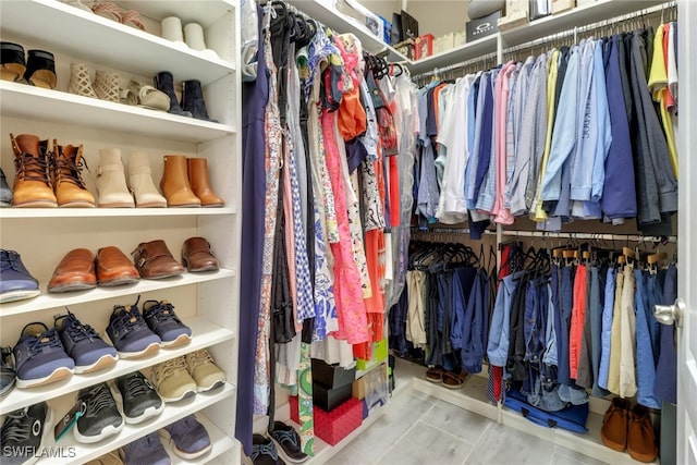 spacious closet with light tile patterned flooring