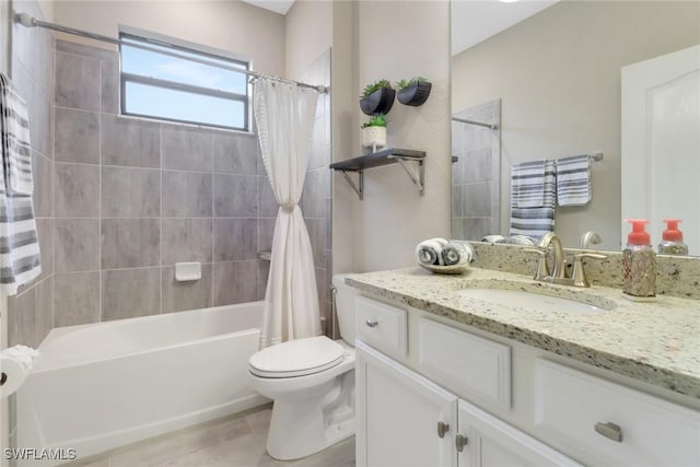 full bathroom featuring shower / bath combo, toilet, and vanity