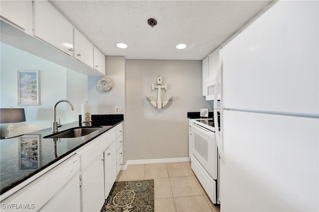 kitchen featuring sink, white cabinets, light tile patterned flooring, and white appliances