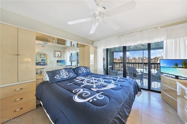 tiled bedroom with ceiling fan, a textured ceiling, and access to outside