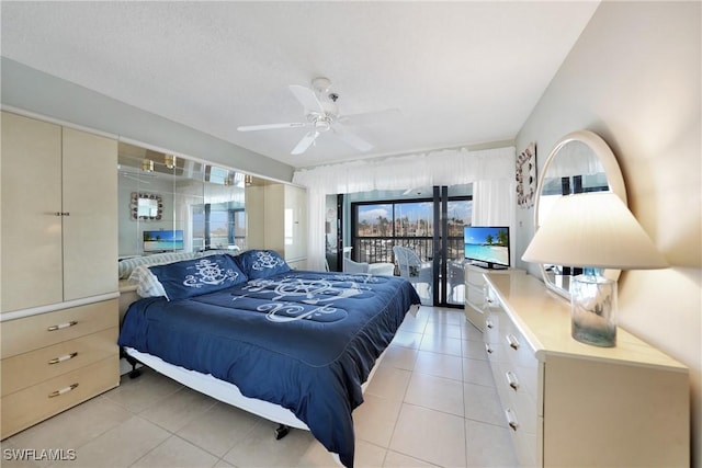 tiled bedroom featuring access to outside and ceiling fan